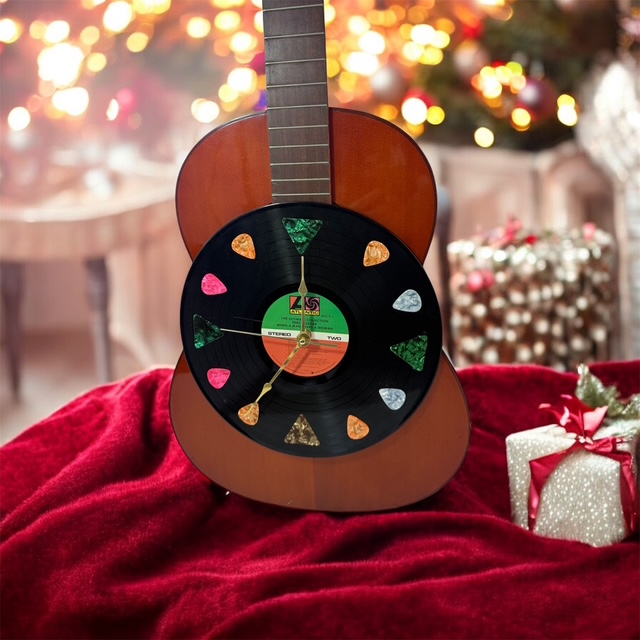 RED ACOUSTIC GUITAR WITH A 33 RPM RECORD